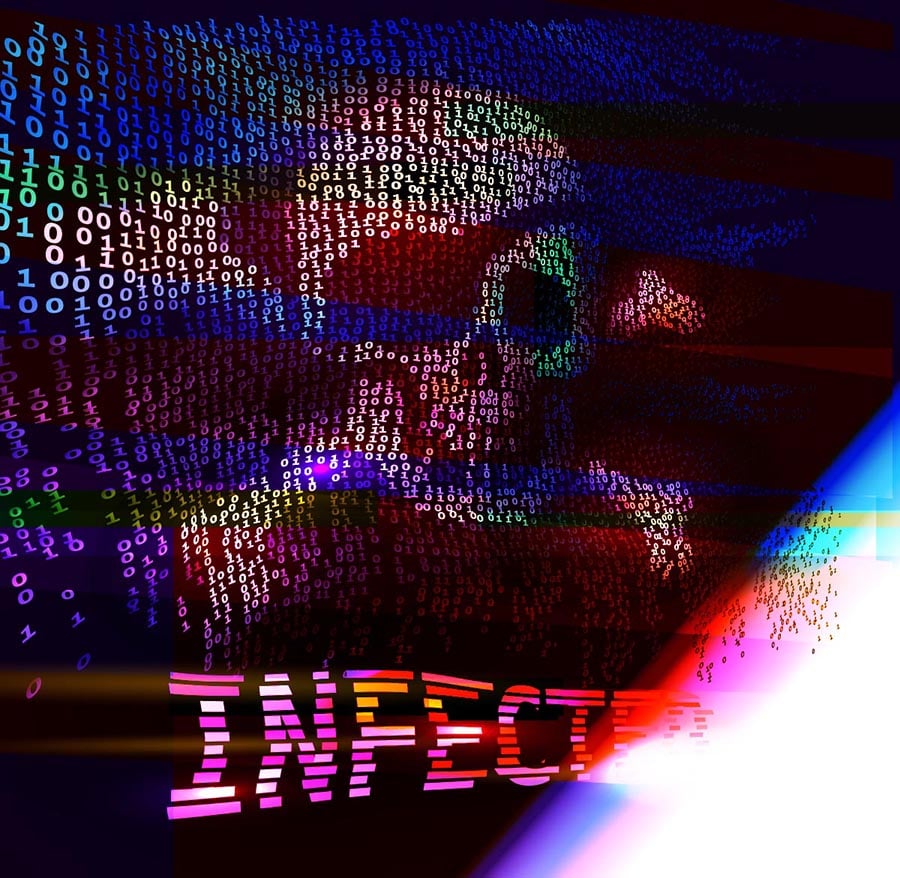 Symbolfoto für einen Ransomware-Angriff. Sichtbar ist ein Totenkopf auf einem verschwommenen Bildschirm