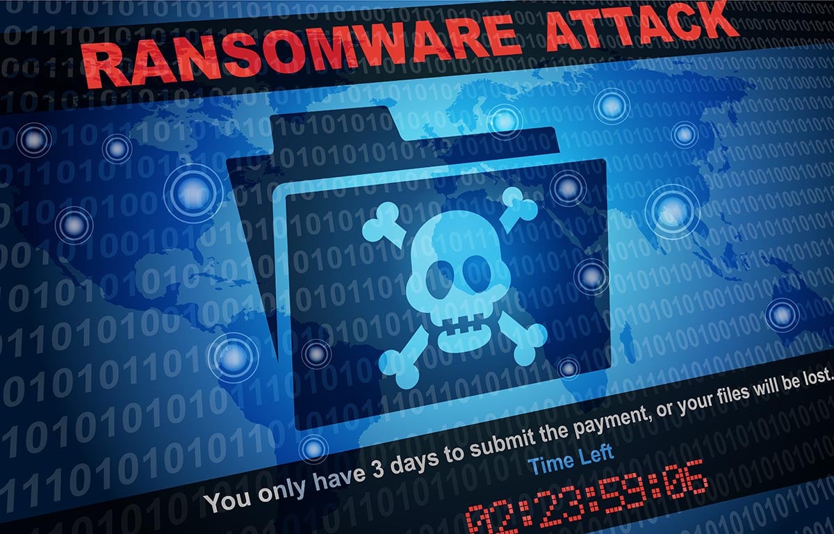 Bildschirm mit einem Totenkopf und dem Schriftzug Ransomware Attack - Symbolfoto für Angebote mehr IT-Sicherheit von Keepsmile Design